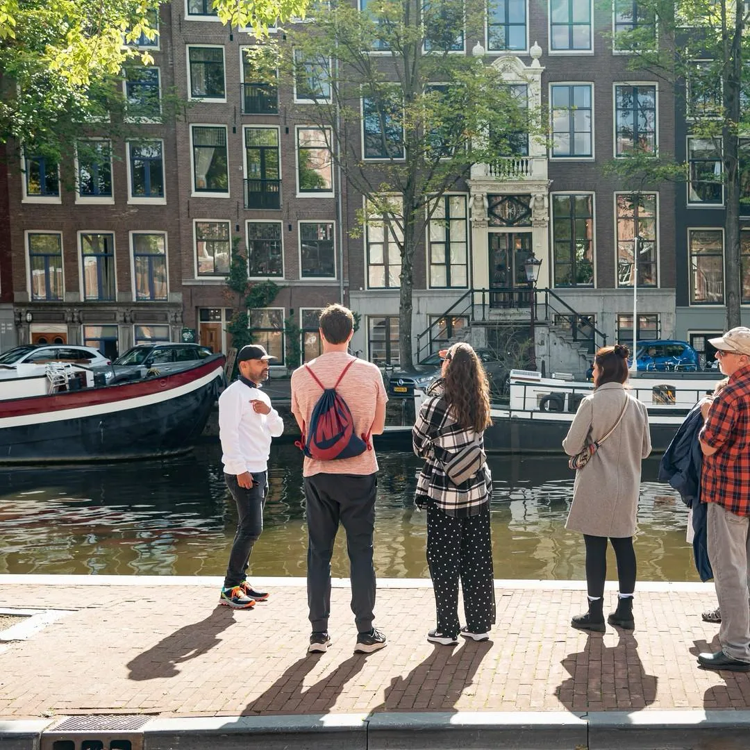 Historic streets and canal bridges on an Amsterdam walking tour