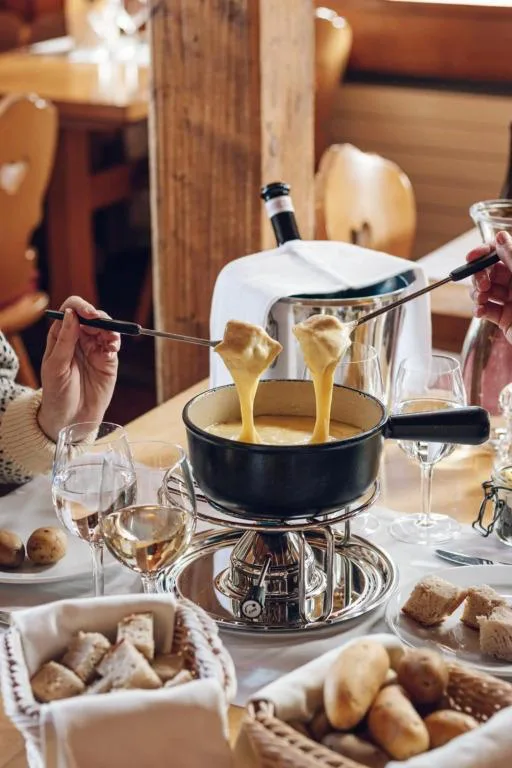 Traditional Swiss cheese fondue dining experience