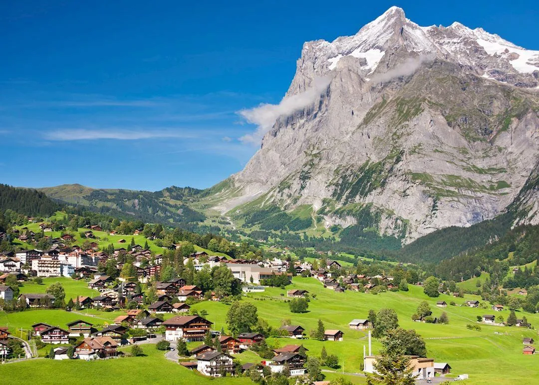 Mountain village of Grindelwald surrounded by the Swiss Alps