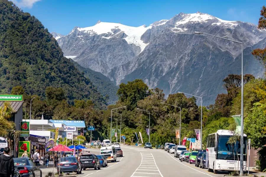 Franz Josef village surrounded by rainforest and mountains